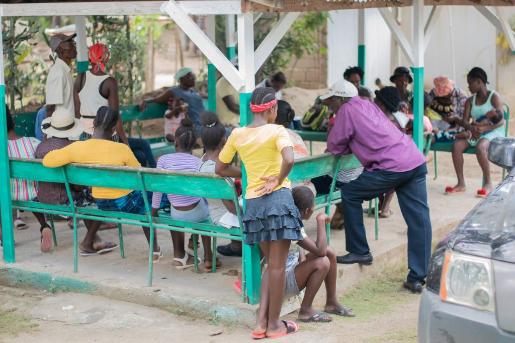 People gather at the Roche Plate clinic